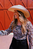 I bought this to wear for a girls trip and loved it! I liked that I could tuck it into my high waisted pants and it didn't bunch on the inside since it isn't super thick and is slim fitted. I also loved the sleeves because they were more of thin mesh type material so I didn't get hot. - Madison S.