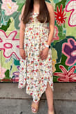 I love the flower print on this dress, but the fabric is not as high quality as other Lulus dresses. The fit is good but the sleeves were a bit awkward. I tucked them in and wore it strapless, which was looked very cute! It also held up very well, so I wasn't adjusting/pulling the dress up all night. There are two slits on the dress, not one, and they both run very high. I safety pinned them so the slits weren't quite as high and it worked perfectly! I'm very happy with this purchase! - Regina R.