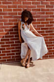 I love this dress so much! It's incredibly well made and so pretty/flowy! I think you could had sandals or even cowboy boots! It's just amazing honestly. :) - MelissaRoshan P.