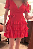I bought this for a Christmas photo shoot in Italy but then opted not to wear red. Unlike similar Lulus dresses I tried this one was not too big in the top or too low cut. This is absolutely adorable with the ruffles and bow. Kept it anyway! - Kerri P.