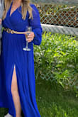 I loved this dress! I wore it to a spring mountain wedding and got so many compliments. It fits so well and was super comfortable. I have a c-section pouch that I'm self-conscious of but this dress hit me at my narrowest part of my waist and still hid my lower tummy area. The slit was a good length and not too revealing. Its a little long; I'm 5'3" and wore it with 4 inch heels and still had to get it hemmed. I paired it with a gold belt and I felt so confident all night while dancing and taking photos. - Katie G.