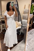 I am always a small in dresses, especially from Lulus but reading these reviews I sized down to an xs and had to exchange it for a bigger size because I was suffocating. The band around the torso under the breast is not stretchable and has no give. My fiancé had to zip me into it so tightly that I then couldn't breathe. That being said the dress is adorable and will be perfect for my rehearsal BBQ once I get my right size shipped in. - Racquel M.