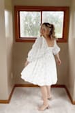 This dress was absolutely perfect and beautiful for my baby shower. I ordered a size up and it fit my midsize pregnancy frame great. I would say true to size! - Marley B.