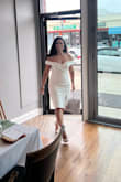 This dress fits true to size and fit like a glove. I wore it for my bridal shower and I got so many compliments on it! The material is soft and stretchy, the length is perfect, and the off-the-shoulder caps stood in place. - Alina F.