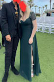 This is one of my favorite dresses I've ever bought. It is incredibly flattering the style and color are absolutely beautiful. I however had issues with the quality of the dress. I only wore this dress for one night for my friend's wedding. The dress ended up with rips and tears all over it and there were weird stains on the back of it by the end of the night. Im not sure how all of this happened to the dress in five hours at an event I was mostly sitting the entire time for. The dress was on the bigger side which was probably just me ordering the wrong size, but there were rips on the seams as if it was too small and the top layer of fabric was torn in several places. I'm unsure as to how all of this damage happened but it is probably impossible to wear it again. I do really love this dress I just wish that it held up better than one wear. I didn't even get to wear it for more than five hours... - Courtney O.