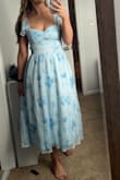 This dress fit true to size and was very flattering. Material felt high quality. I got compliments on it all night. - Ashli N.