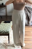 Initially got them in a Large but sent them back and ended up with a Medium. Fit great! I'm tall and have long legs - and can wear these with platform shoes! - Robyn W.