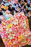 The fabric is nice and light for warm weather. The crinkle texture is awesome because you can throw them in a bag and they stay nice. Flattering cut overall - definitely high-waist. If you wear them any lower, there is too much fabric in the crotch. You might want to wear shorties underneath depending on fit because the open leg does go all the way up. I got a similar pair as well and love the colors on both! - Veronica E.