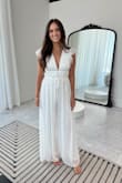 I bought this to wear wedding dress shopping and it was perfect! I felt so pretty and have gotten so many compliments on it. It does run a little tight but I wouldn't size down. - Morgan M.