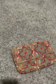 This is such a cute and detailed purse. Perfect for an orange dress on a night out - Hayley E.