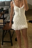 This is the cutest dress I have ever ordered online. It is a little short on me but the ruffle helps. The adjustable straps and tie top are amazing. I love love love it. - Audrey L.