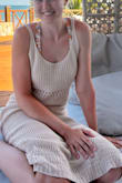 Hugged my body in all the right places and really enjoyed the length. You do have to pick it up a bit to go up stairs as the hem on the bottom won't stretch, causing your legs to only separate so far. Not a deal breaker for me though. It's soft and cozy to wear at a resort. - Erin W.