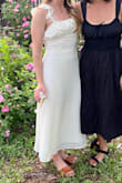 I bought this for my engagement party and loved it! Im short and many dresses here are too long for me but this midi was perfect and very shapely (compared to most midis). I loved the fabric and the bow was so elegant in the back. I do recommend some sort of backless bra! - Melanie W.