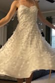 This is the perfect sundress and is made for spinning and twirling around in! I'm going to wear this as my 'dancing' dress for my wedding and I'm so excited! It's a bit see through in the skirt area and the top is not as structured as I thought from the photos, but it's very comfortable and beautiful! - Elizabeth N.