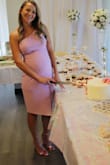 I wore this dress to my baby shower. I am 6 months pregnant and usually buy an XS and sized up to a small.  It fits great. A little loose in the bust but nothing a little bit of fabric tape couldn't fix.  Fabric is kind of thin so I had to wear a bra.  I hope I can wear it to a wedding at about 7 months pregnant. - Sanja H.