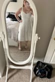 It is a smidge tight but it otherwise fits perfectly. This is going to be my engagement party dress and/or rehearsal dinner dress. It's so perfect and has pockets!!! It's a little long on my short self, but it's ok! I love it. - Christine L.