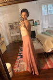 This skirt is a beautiful color and shape! 

For me, it was a little big. It fits lower on my hips, but I'd prefer it to fit right at my waist. Also quite long, it drags on the ground in the back. Hopefully, it shrinks a bit in the wash! - Abby S.