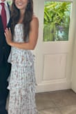 I wore this to my boyfriends work event. It was extremely comfortable and got so many compliments! It does kind of bunch up funny near the middle of the bustier top, but it didn't look bad or distracting. The zipper on my dress worked fine. - Haley N.