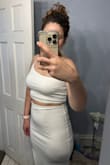 I bought this for a white party in Aruba. I have big hips & a smaller waist. I'm usually a M in tops and a L in bottoms. This fits really nice. The fabric is stretchy but doesn't have too much give. I can't wait to wear it. I would say it's true to size. I'm 5'7, 160 lbs & a 36C. - Amanda G.