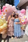I received so many compliments while wearing this to my best friend's baby shower. It was comfy, and it hid my 4 month baby bump. I liked it so much I ordered the same dress in black too. True to size. I read other reviews that warned the zipper can stick, so I made sure to be careful while zipping and unzipping the dress. Overall I loved the dress. Highly recommend! - McKenzie K.