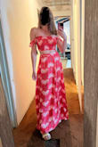 I wore this to my bridal shower that was a fiesta themed pool party. I purchased a size Medium, which is my normal size. The top fit perfectly and the bottom did too. Can definitely dress it up with heels, but it hits perfectly when I wear flats.  10/10 recommend - Stephanie L.