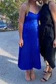 Beautiful color. Texture makes it feel a little more fancy. Adjustable straps and mid length! Would buy again. - Catherine W.