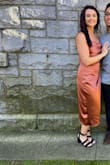 This dress was a hit! It did come very wrinkly, however it was easy to iron and looked shiny and smooth once on. Super comfy and a good midi length on me (5'4"). - Melanie D.