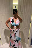 I was able to tie the top in a simple knot in the front (pic) but preferred a bit more coverage - by going around & under my bust I was able to tie it in the back to have an alternate look. After hanging in the wardrobe for a day and spraying with downy wrinkle release I didn't feel the need to iron - on vacation, after all. A medium may have hit but the skirt likely would have been tight in the waist for me and don't think I could have adjusted the top as I did. Skirt worked great with a plain black ribbed tank. Don't think I'd wear the top a la carte but overall great purchase. - Pamela F.