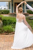 I received so many compliments on this dress and felt so beautiful in it on my wedding day. I loved the adjustable cross cross back design and amazing twirl-ability. It fit almost perfectly, I just had it shortened a little to make walking and dancing easier. - Devin C.
