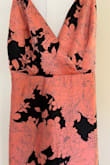 Pretty dress. It's not really tight on me but the top doesn't work well for me (30G bra size) as it gaps open - but I am hoping to sew/modify it so I can wear it. The fabric is nice. However as other reviewers have pointed out, the color of this dress is quite different from the Lulus photos of this dress. It is not dusty rose. The dress is most definitely salmon/coral/orangish. Look at other reviewer photos to get a better sense of the color of this dress. It is much brighter in person than I was expecting. - Isla C.