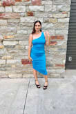 I wore this dress to a wedding and got lots of compliments! I love the way the fabric can be moved around to flatter the tummy. It comes in fun colors too. I normally wear a Medium but I ordered a Small based on other reviews and it was perfect. - Jennifer S.