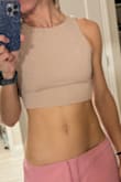 The top is not bad, but would be better if it was a ticker or double layered material. The nipples are slightly visible under good light. Also you need to tie it tight for it to fit perfectly well. - Barbara K.