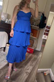 Wore it out for a "glam" night birthday celebration. I loved the layers, reminds me of a cupcake. Fit comfortably, but the material in the middle bunches as if it's too small. I wore a medium but tried a large and it didn't make a difference with the bunching. Still loved it. - Brittany M.