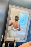 Not a huge fan of the bust in the front on myself personally but the back is great it's a beautiful dress - Ashley M.