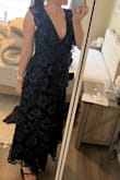 This dress is so comfortable but also so elegant! The fit is slightly large (but I don't mind) I'm typically a medium and this gives a little room and doesn't feel tight at all. I may need to add a few stitches in the chest area to make it less low cut. It really is a beautiful dress and I can't wait to wear it! - Erika J.
