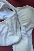 The material easily gets stained by sand, leaving a noticeable yellowish tint on the swimsuit. I used it only once. - Dorin R.