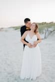 I bought this dress for my beach wedding and it was perfect! The only alterations I needed was to get it shortened a little bit but the rest fit perfectly! I was very surprised with how beautiful my dress was considering it was under $100. I got so many compliments too! The best part was that I am only going to wear it one day and since we were on the beach I didn't want a fancy expensive dress to have a chance of getting ruined. I'd highly recommend! - Rachel B.