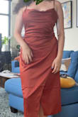 I've been searching FOREVER for a rust dress that doesn't have cool undertones and isn't flimsy material, and this is it!! The color is beautiful, the dress is form-fitting without being clingy, and the slit is relatively modest. This is perfect for a wedding with cocktail attire. - Lauren F.