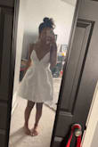 The dress is a crisp white which is exactly what I wanted. The style is so cute and I love the low cut in the front. The straps are adjustable which is wonderful. I don't have a big chest but I feel like support wouldn't be an issue for small- mid chested women. Speaking from little experience though. The dress itself is very much true to size. and the length is good for me. I wasn't sure Id love the style on my body but it's absolutely adorable and I'm excited to find somewhere to where it too. - Kara S.