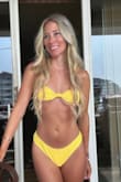 Love this bikini top! The bright yellow is perfect for summer and makes your tan absolutely pop. The cups are a little unshapely (there's no wiring), so they do fall down a little. If you were blessed with small-chested lemons rather than melons, then it shouldn't be a problem! - Erica K.