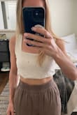 I loved this when I first purchased it, it fit exactly like the photo. However, despite following the care instructions exactly (hand wash cold, line dry), it shrank so much that I can't wear it anymore. Fit is totally different, it's shorter, and the hem is uneven. Not worth $40 for a tiny shirt. - Rachel A.