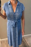 I didn't realize this dress was 100% rayon and is hand wash/line dry. I washed it regularly and put it in the drier which gives it this wrinkled look, but I still like it. It did shrink a bit in the drier. The bottom two buttons come undone sometimes which is a little annoying, so I may sew it shut. - Maia A.