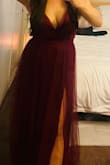 Super high slits. Beautiful. Tulle makes it look so fancy. I had it hemmed because I'm short and most Lulus dresses come long on me. Dark burgundy color. My boobs were also popping out lol but I guess in a good way - Jennifer G.