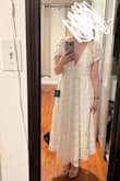 This dress is absolutely INCREDIBLE! It runs big so I would recommend going down a size (which is what I ended up doing), but it's absolutely gorgeous and looks/feels very high quality. It has really unique 3D floral accents, and it also has the perfect amount of plunge; the back straps give a surprising amount of support, and I didn't need to wear a bra or sticky tape with this because of how secure the back was. I bought this for my engagement party and loved it so much I'm going to wear it for my bridal shower too. I highly, highly recommend! - Molly G.