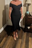 The fabric is stretchy and thick (in a good way). No zippers or snaps - all one piece. It looks beautiful in person. - Kristin J.