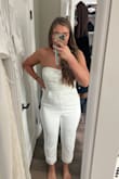 I bought this for my courthouse wedding and even though I went with another dress from Lulu's, it was a top contender. It fit me but it was made for standing, not sitting. The top doesn't stay up well and the bow is super difficult to put on (it snaps onto the back of the romper). It was a good runner up-might fit better with bigger boobs, smaller waist and smaller thighs - Devyn B.