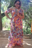 This dress has a very nice quality. Although it runs a little (actually, very little) smaller on the waistline, makes a very flattering fit - I usually wear a size L, but like looser fit! It has a lovely, asymmetrical sleeves and a playful glide skirt that looks amazing when dancing (wore it to a wedding, and rocked the dance floor with it!). Also, colors are great, vibrant, just as it looks in the models photo. - Alejandra M.