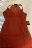 The dress is beautiful
Soft and silky 
The color is gorgeous
However, the fit on the boob section is weird if I loosen the straps it's too baggy and If I tighten it it looks like I'm flat and my boobs are by my throat
Bummed 
Final sale item so not a good purchase for me. - Jennifer G.