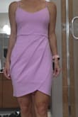 This dress has a beautiful color and looks like the color in the picture. It is a simple but beautiful design with the front panel crossing over. It is feminine, sexy, girly...you can really make it your own based on how you pair it. It is comfortable too. I was a bit concerned with about length as I will need to move around and be around kids (mom's know this is important) so no malfunctions or embarrassing moment. It could use a tiny bit more length as I am not tall so consider if you are tall unless you want more of a mini then you're set. Also I would have loved a zipper as you have to slip over head. It makes me a little nervous over time. Don't want to tear it etc. - Kim V.