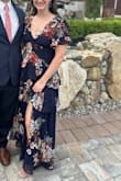 I wore it to a wedding and got lots of compliments! I'm usually between a medium and large with leaning towards large for most items but they only had a medium and it fit, a little snug but I was comfortable the whole night. I really liked the buttons and overall look of the top. The only reason I didn't give it a 5 star is because the slit is really only noticeable if you stick your leg out so it is a little bit different from the model photo but overall really pretty! - Angelica D.